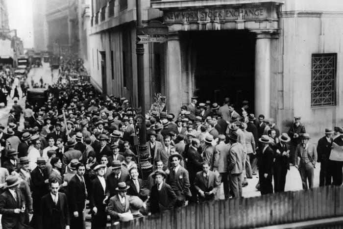 The crowds on Wall Street, New York, after the stock exchange crashed.<br/>